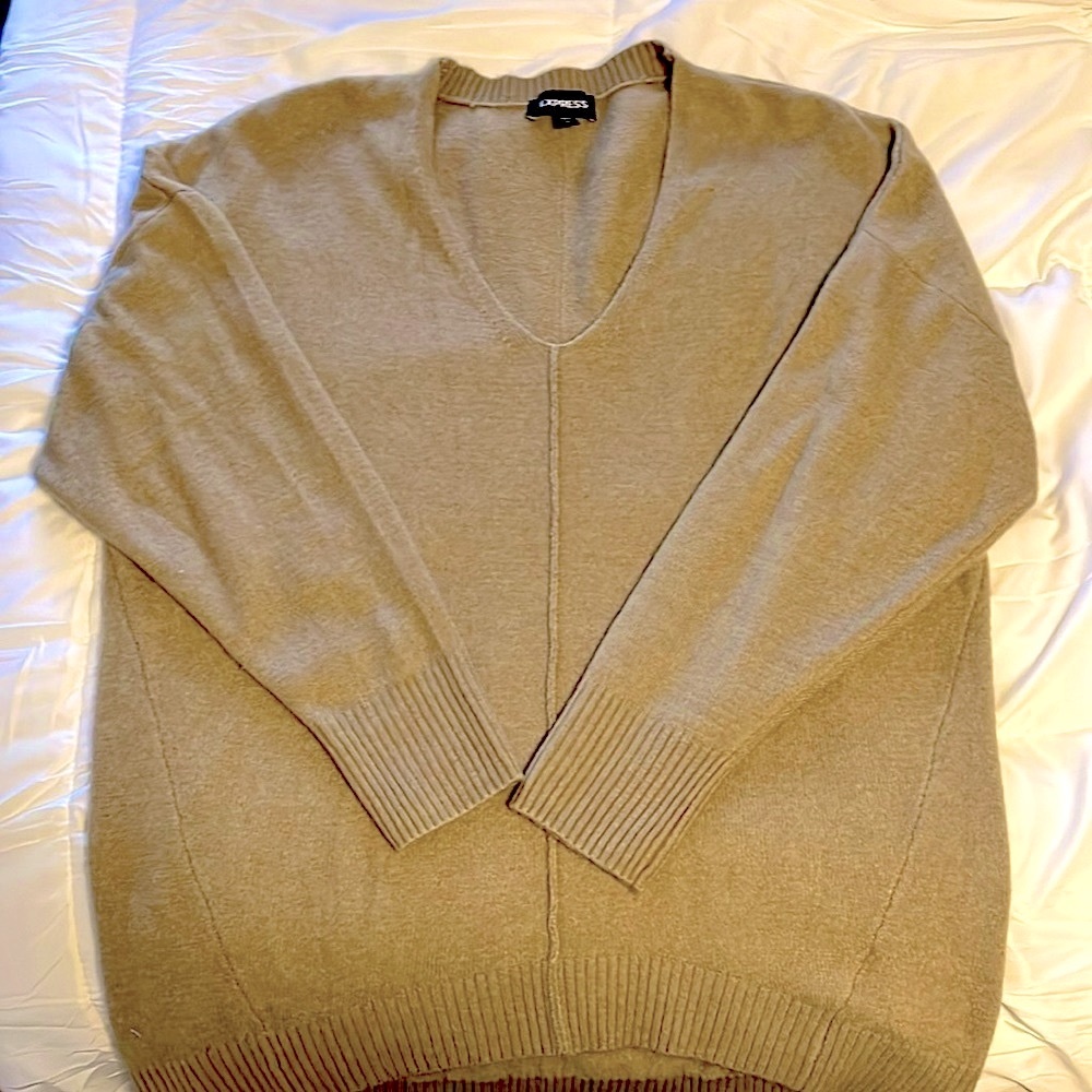 Sweater this is a tan color. It’s very soft size generous size medium